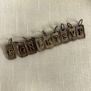 Waxing poetic. Tag Insignia charm